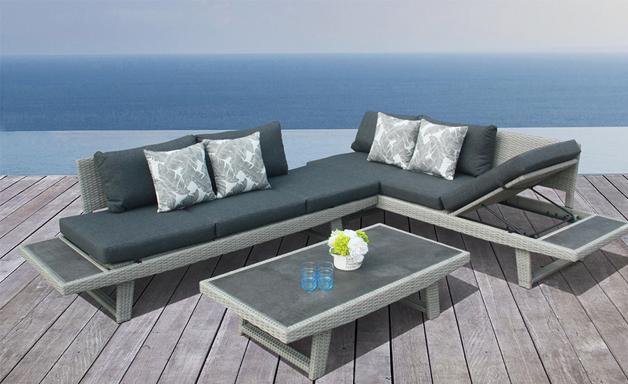 modern grey rattan sun lounger sofa with dark cushions