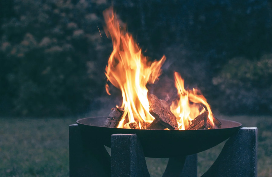 fire pit burning logs at night
